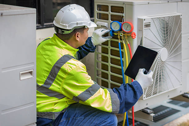 Professional Hvac technician working in South Walpole, MA
